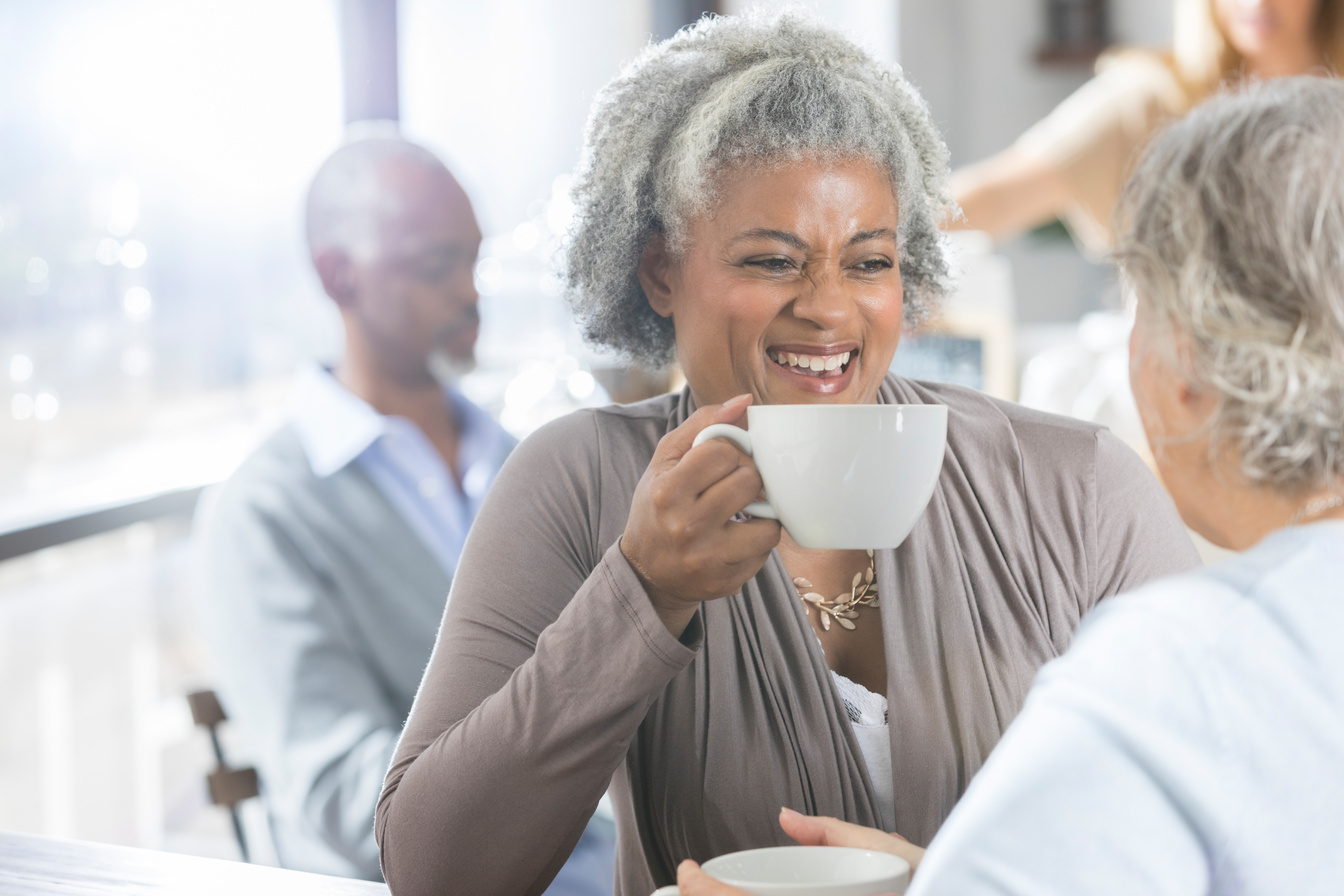 Diverse senior women having coffee